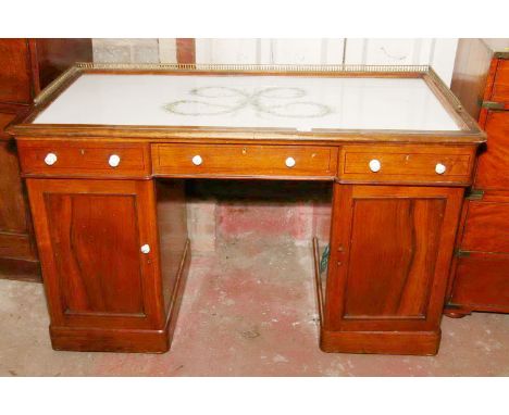 Late 19th/early 20th century mahogany dressing table, with brass three quarter gallery top, having ceramic top with foliate d