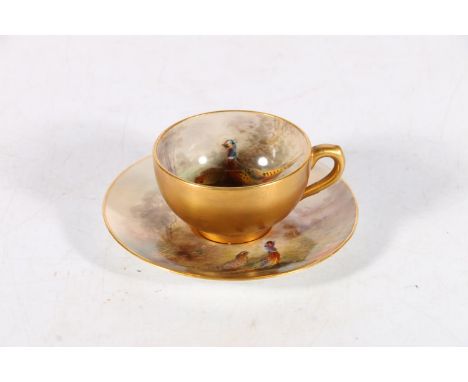 Royal Worcester porcelain cabinet cup and saucer decorated with pheasant design and signed 'Jas Stinton', date code for 1920,