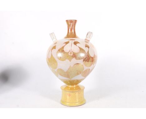 Lustre glazed terracotta amphora style vase with two ring handles raised on circular base, in the manner of ALAN CAIGER-SMITH