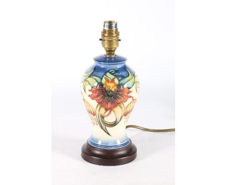 Moorcroft table lamp of baluster form with floral design, 26cm to top of lamp holder.&nbsp;&nbsp; 