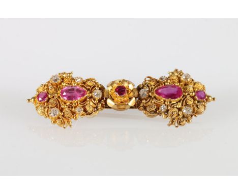 Unhallmarked yellow metal diamond and ruby bar brooch with filigree work, 11g gross. 