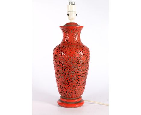 Chinese plaster baluster shaped table lamp, painted red, with foliate design, 40cm to top of lamp holder. 