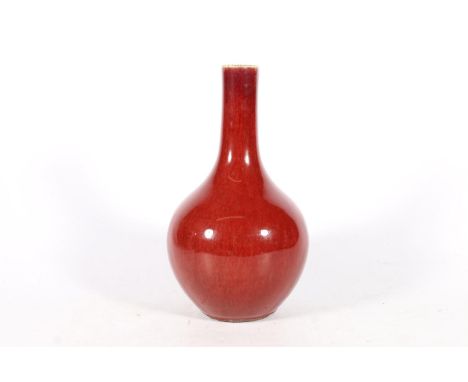 Chinese flambe sang de boeuf blood red bottle vase, 21cm tall.  Some light scuffs to the glaze. Appears free from chips and c