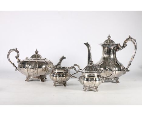 Contemporary Elizabeth II silver four-piece tea service of pumpkin form decorated with embossed floral sprays, by Mappin and 