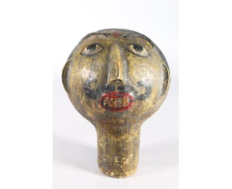 Indian carved wood and plaster mannequin head in the form of a gentleman with moustache, cm tall.