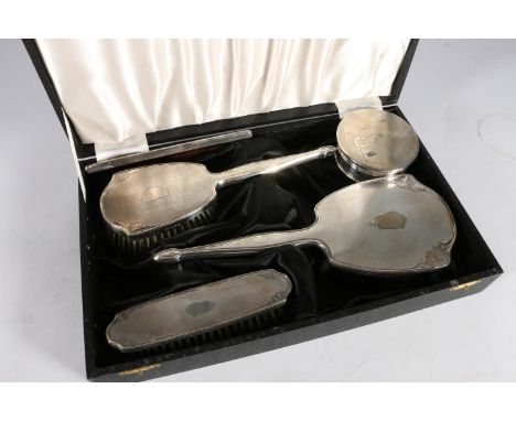 Silver four-piece dressing table set by Adie Brothers Ltd, Birmingham 1962 with a similar jewellery box by Adie Brothers Ltd,