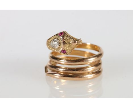 18ct gold snake ring, the eyes picked out with small rubies and a large teardrop shaped diamond set to the head, stamped 'K18