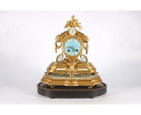 French gilt metal clock with star studded enamel dial, and floral plaques, on gilt wood base and another tablet shaped base, 