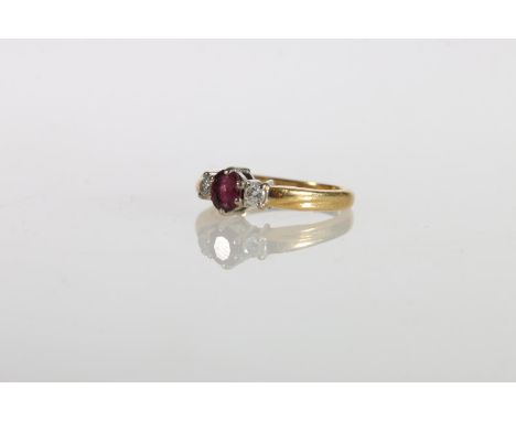 18ct gold ruby and diamond three-stone dress ring, maker L B Ltd, size I, 2.8g gross. No obvious condition issues.