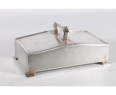 George VI silver table cigarette box with central handle and Celtic knot border by W H Manton Ltd, Birmingham 1948, 767g gros