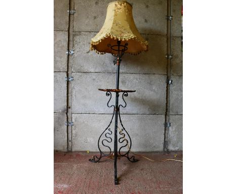 Late 19th/early 20th century converted standard lamp and table, with circular brass tabletop, with piecrust edge, raised on s