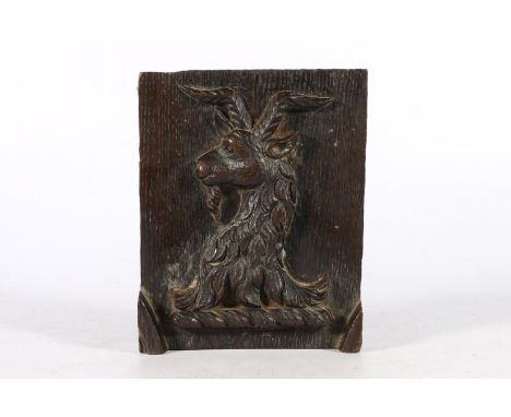 Late 18th century carved oak panel depicting a horned goat of a family crest, 16 x 13cm. 