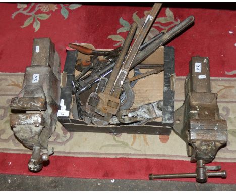 Two metal bench vices and various tools 