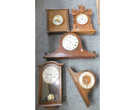 An American Ansonia Clock Co oak mantle cloack dated 1892, three other mantle clocks and a wall clock (3) 
