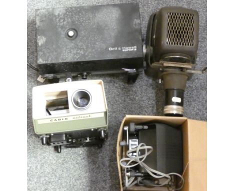 A Bell and Howell slide projector, an Aldis slide projector and two other projectors 