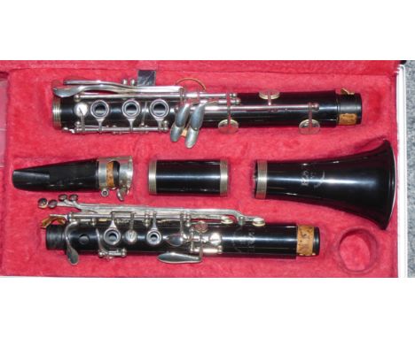 A cased clarinet by B&amp;H Bandhite, made for Boosey &amp; Hawkes '78. 