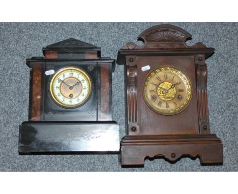 A black slate classical temple style mantel clock with mottled red marble detail, brass face and Arabic numerals, height 32.5