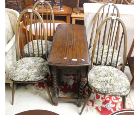 An oak drop leaf gate leg table with barley twist supports and a set of Ercol dining chairs (5) 