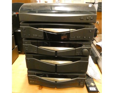 A Kenwood stacking music system with multi CD, amp, AV control center, cassette deck and turntable, together with manual and 