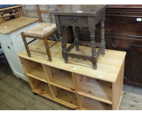 A modern pine open shelf unit, a stool and a child's rush seat chair