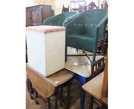 An oval gate leg table, a loom linen bin and two green loom chairs