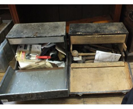 Two tool cabinets containing various tools