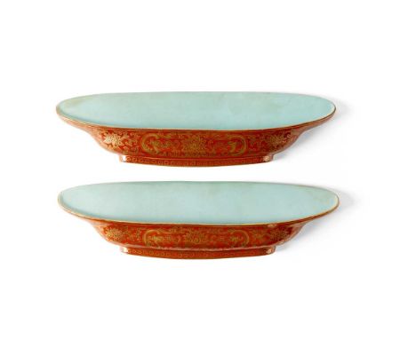 PAIR OF CORAL-RED-GROUND GILT-DECORATED WALL PLATES QING DYNASTY  清 珊瑚紅地松石綠釉描金夔龍纏枝蓮紋壁盤（共兩件） each of flattened form moulded as