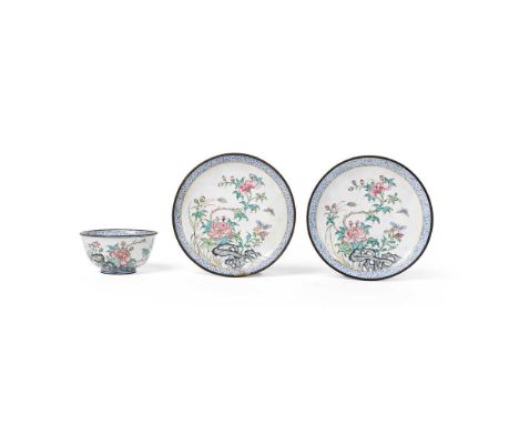 GROUP OF THREE PAINTED ENAMEL WARES QING DYNASTY, 18TH CENTURY  清 銅胎畫琺瑯蝶戀花紋杯及盞（共三件） comprising two saucers with a cup, all si