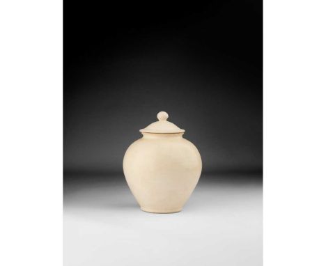 WHITE-GLAZED JAR AND COVER  TANG DYNASTY  唐 白釉蓋罐 finely potted with an ovoid body on a flat foot, rising to short waisted nec