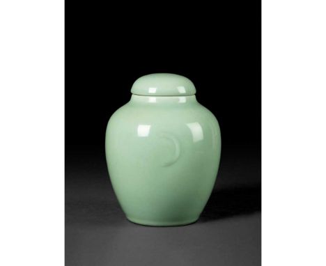 CELADON-GLAZED JAR AND COVER  QING DYNASTY, DAOGUANG MARK AND OF THE PERIOD   清道光款及年代 冬青釉月牙耳茶葉蓋罐 the ovoid body smoothly risi