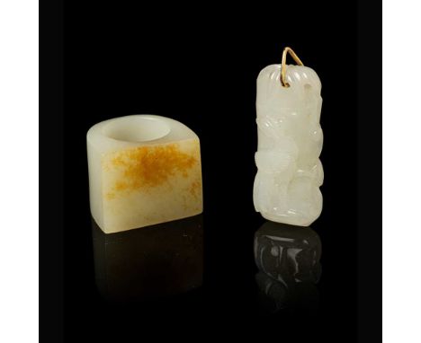 TWO WHITE JADE WITH RUSSET SKIN CARVINGS QING DYNASTY, 19TH CENTURY   清 白玉帶皮扳指 及 瑞鳥靈芝圖吊墜（共兩件） one thumb ring cleverly feature