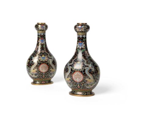 PAIR OF CLOISONNÉ ENAMEL GARLIC-HEAD VASES QING DYNASTY, 19TH CENTURY   清 銅胎掐絲珐瑯墨地雙龍捧壽紋蒜頭瓶 (共兩件) each of slightly flattened b