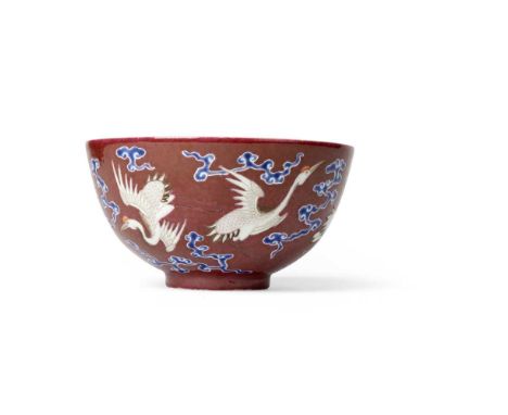 RUBY-RED-GROUND BLUE-ENAMELLED 'CRANE' BOWL QIANLONG MARK, 19TH-20TH CENTURY   十九至二十世紀 乾隆款 胭脂紅地藍彩雲鶴紋碗 the deep rounded sides 