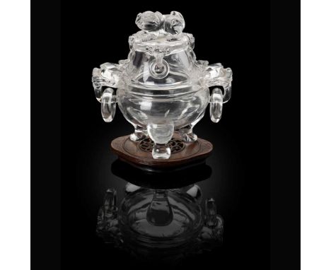 ROCK CRYSTAL TRIPOD CENSER WITH COVER  LATE QING DYNASTY TO REPUBLIC PERIOD, 19TH-20TH CENTURY  清末民初 水晶雕獅耳銜環三足蓋爐 帶木座 the cens