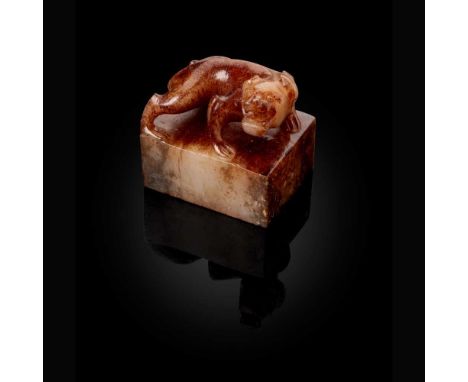 WHITE JADE WITH RUSSET INCLUSION 'TIGER' SEAL  白玉帶沁虎鈕長方章印文：曲周侯印 景 carved with a crawling tiger on a rectangular podium as a k