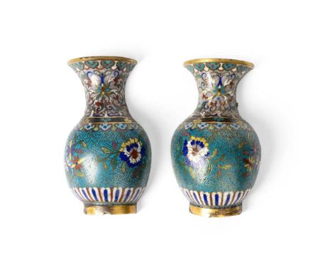 PAIR OF CLOISONNÉ ENAMEL WALL VASES QING DYNASTY, 18TH-19TH CENTURY   清 銅胎掐絲琺瑯花卉紋壁瓶（一對） each bulbous body decorated with leaf