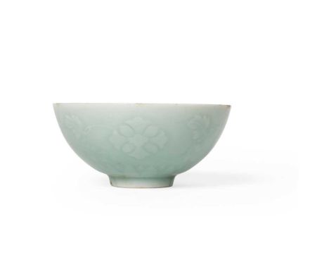 MOULDED CELADON-GLAZED 'FLORAL' BOWL YONGZHENG MARK  雍正款 粉青釉浮雕纏枝花卉紋碗 finely potted with rounded sides supported on a slightly