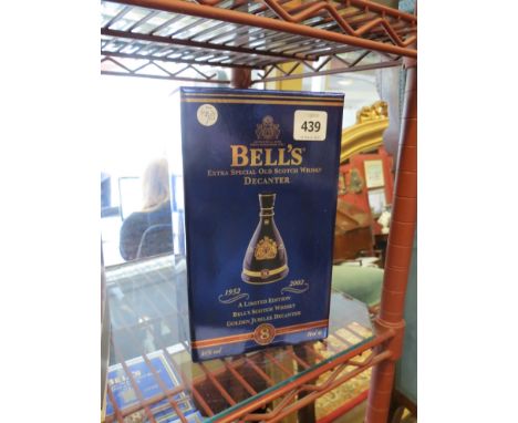A Bells Scotch Whisky commemorating 100 years Queen Elizabeth, The Queen Mother, and a Bells Extra Special Scotch Whisky comm