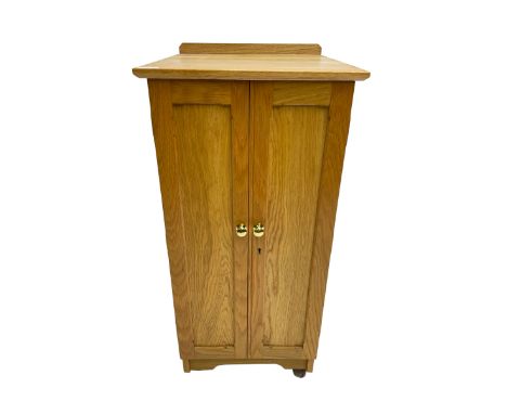 Bespoke light oak floor standing medal cabinet with two panelled doors enclosing fourteen graduated drawers with brass knob h