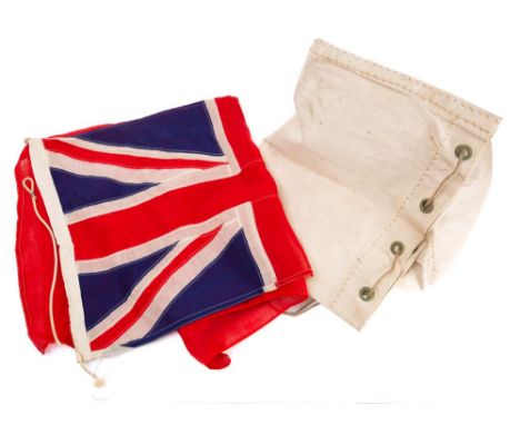 A Red Ensign:, 95x190cm( some light wear and small holes) together with a white canvas kit bag (2) 