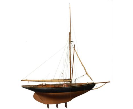 An Edwardian 1/12th scale model of the 10-ton Bristol Channel One Design class 'Coquette': standing rigged with furled sails 