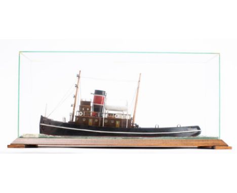 A cased waterline model of the steam tug 'Norman' of Manchester, modelled by W Greenhalgh:  carved and painted hull with  mas