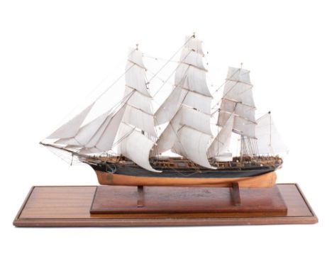 A scale model of the Cutty Sark: running rigged over detailed decks with wheel house and lifeboats etc, the hull painted blac