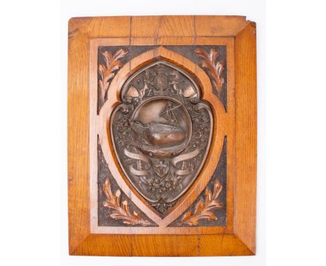 An oak and copper plaque constructed from material of HMS Foudroyant:  the central copper repousse plaque with Royal Coat of 