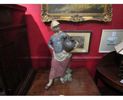A large Lladro figure of lady holding a jug, marked Ana Martinez, No. 211, 61cm tall 