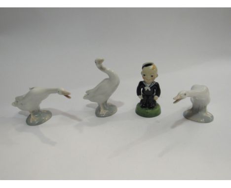 A set of four Carlton Ware collectors' club figures including child designs, together with three Lladro geese figures (7)