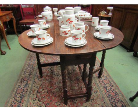 An 18th Century oak gate-leg table the single end drawer over bobbin turned leg supports joined by stretchers