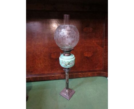 A silver plated Corinthian column oil lamp with etched shade and turquoise floral design reservoir