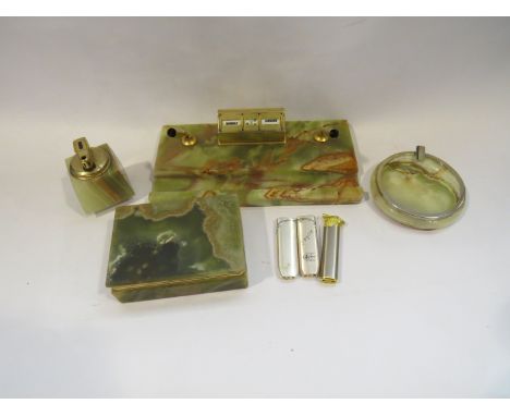 An Onyx lighter, ashtray, box, desk tidy, plus three cigarette lighters