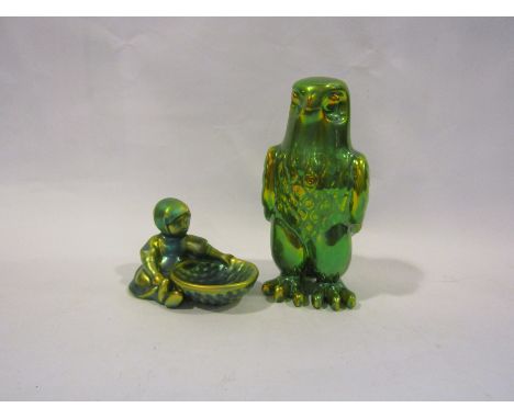 A Zsolnay Pecs lustre glazed pottery eagle together with a figure of a seated girl with bowl (2)